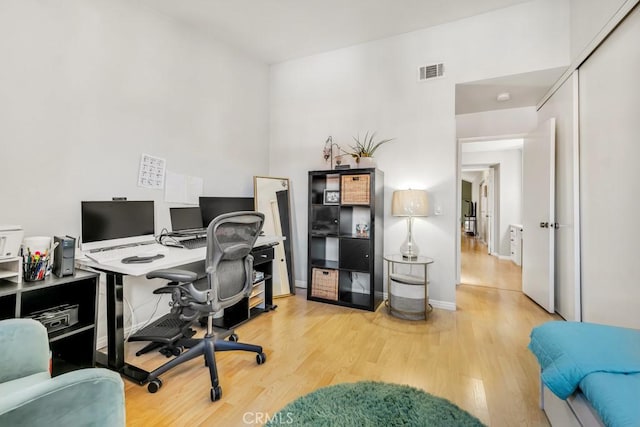 office area with light hardwood / wood-style flooring