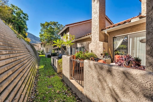 view of home's exterior featuring a mountain view