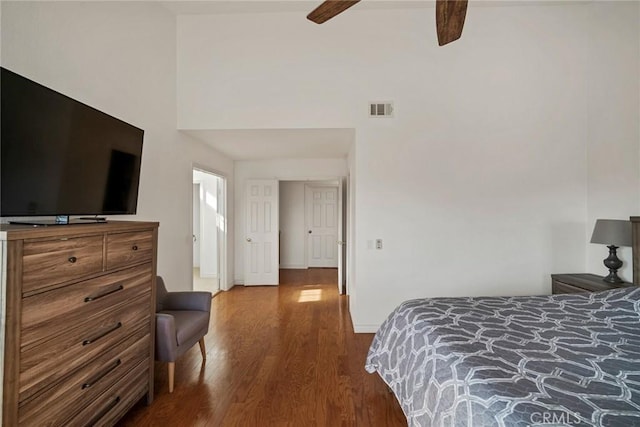 bedroom with ceiling fan and hardwood / wood-style flooring