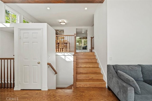 stairs with wood-type flooring