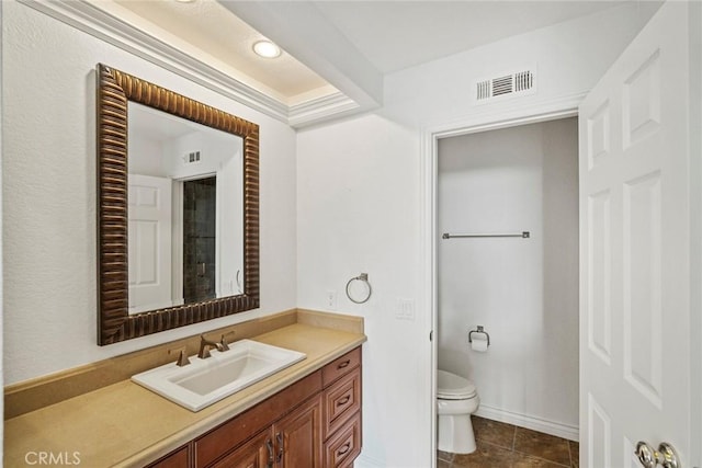 bathroom with toilet, tile patterned flooring, and vanity