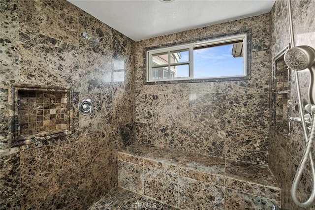 bathroom featuring tiled shower