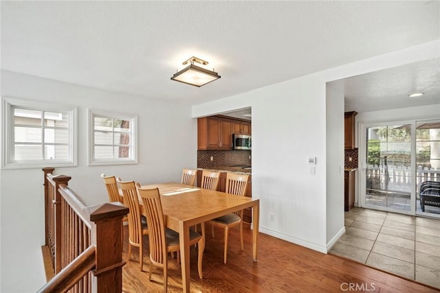 dining area with light hardwood / wood-style floors