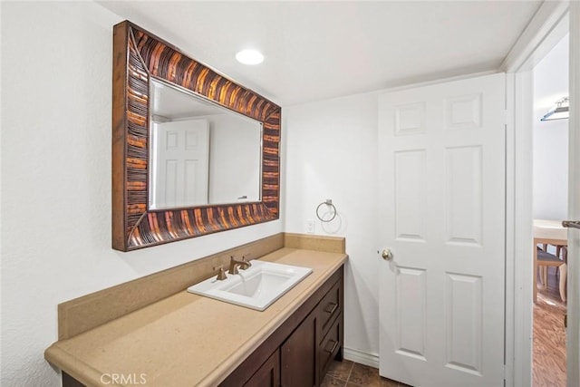 bathroom with tile patterned floors and vanity