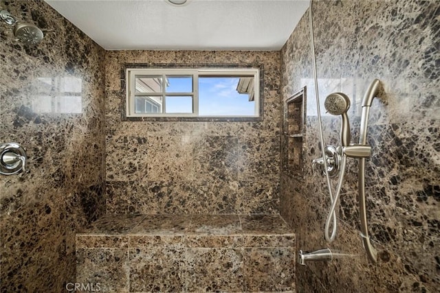 bathroom featuring tiled shower