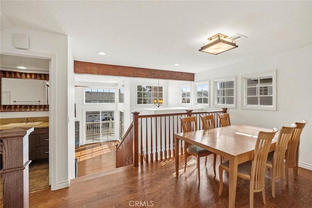 dining area featuring sink and hardwood / wood-style floors