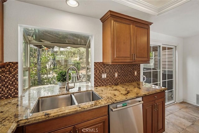 kitchen featuring tasteful backsplash, stainless steel dishwasher, sink, crown molding, and light stone countertops