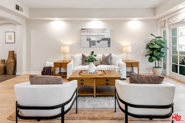 living room with light hardwood / wood-style flooring