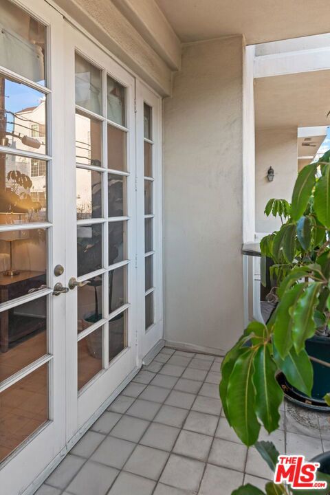 balcony featuring french doors