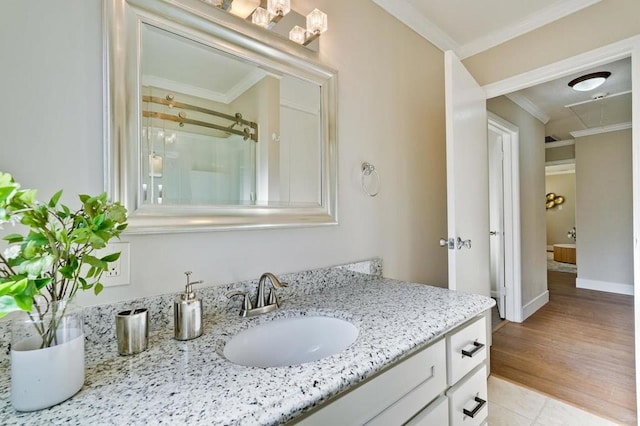 bathroom with crown molding, vanity, an enclosed shower, and tile patterned flooring