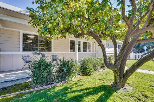 view of side of home featuring a yard