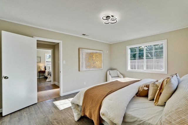 bedroom with hardwood / wood-style floors