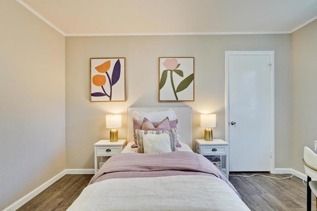 bedroom featuring crown molding and dark wood-type flooring