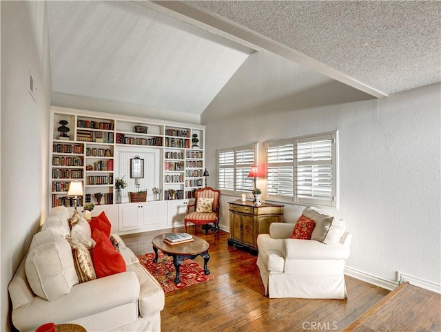 living area with a textured wall, wood-type flooring, vaulted ceiling, and baseboards