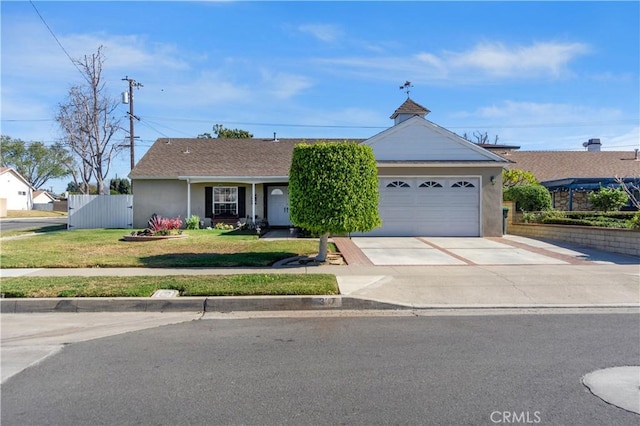 ranch-style home with a front lawn and a garage