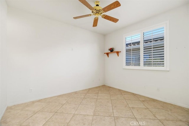 tiled empty room with ceiling fan