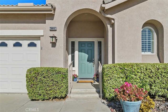 entrance to property featuring a garage