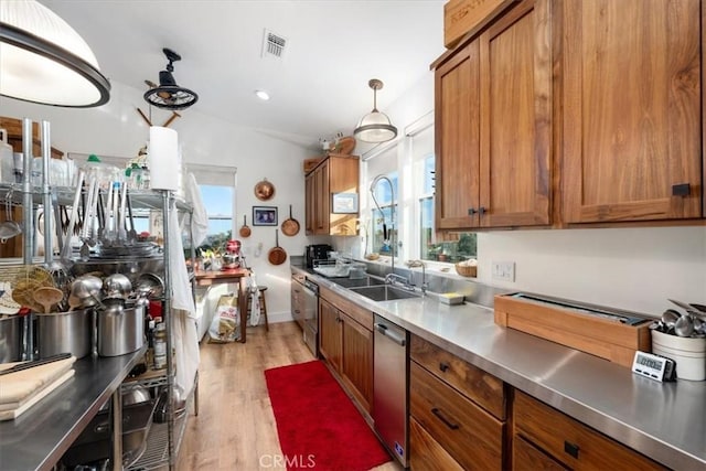 kitchen with stainless steel counters, sink, plenty of natural light, and dishwasher