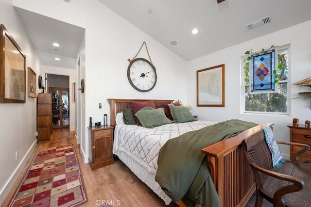 bedroom with light hardwood / wood-style flooring