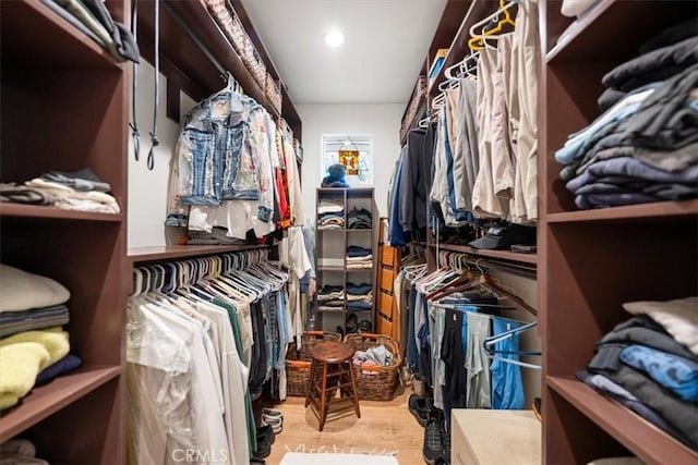 spacious closet featuring light hardwood / wood-style flooring