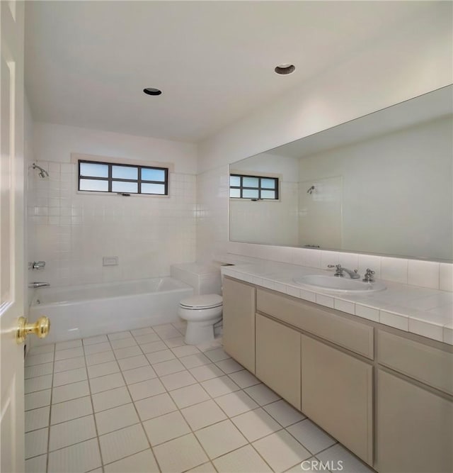 bathroom with vanity,  shower combination, toilet, and tile patterned floors