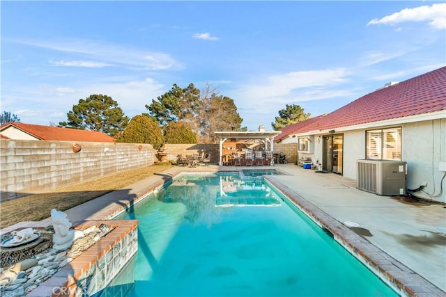 view of swimming pool featuring central AC unit and a patio