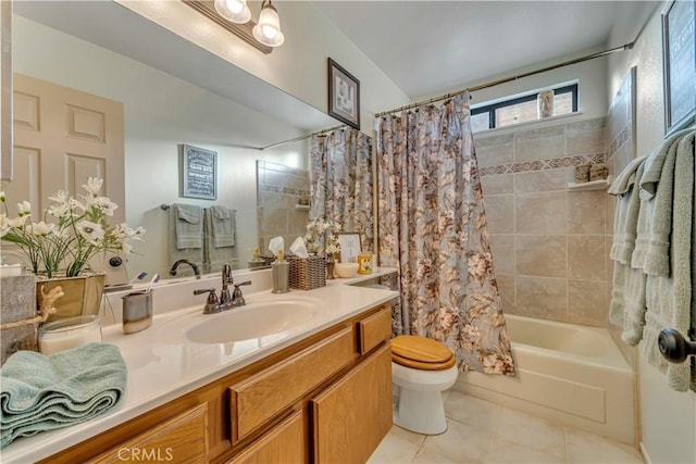 full bathroom featuring toilet, tile patterned flooring, shower / bathtub combination with curtain, and vanity