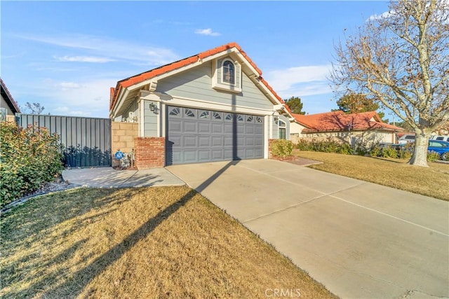 exterior space featuring a garage and a front lawn