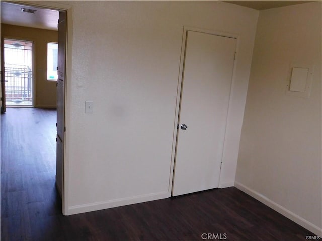 interior space with dark hardwood / wood-style flooring