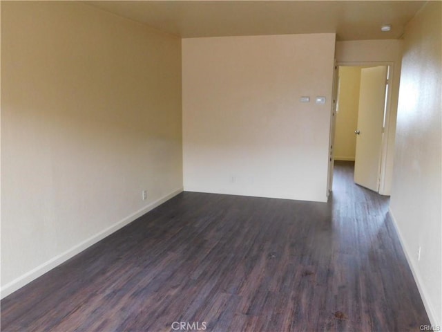 unfurnished room featuring dark hardwood / wood-style floors