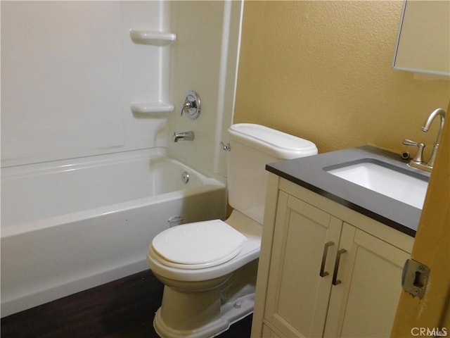 full bathroom featuring toilet, vanity, shower / bathing tub combination, and hardwood / wood-style floors