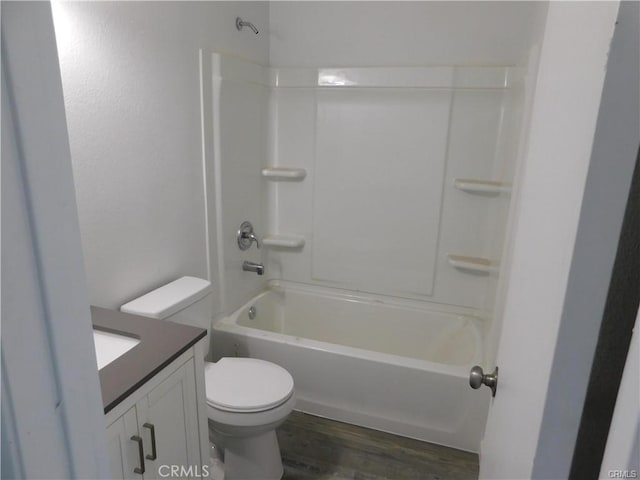 full bathroom with toilet, shower / bathtub combination, hardwood / wood-style flooring, and vanity