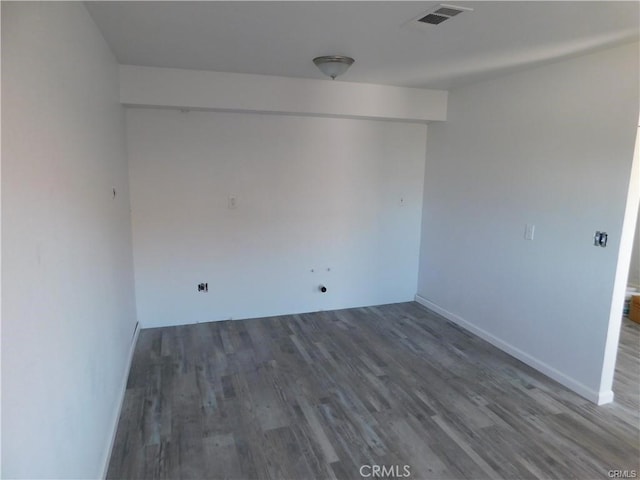 unfurnished room featuring dark hardwood / wood-style floors