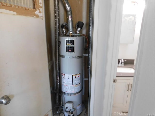 utilities with sink and strapped water heater