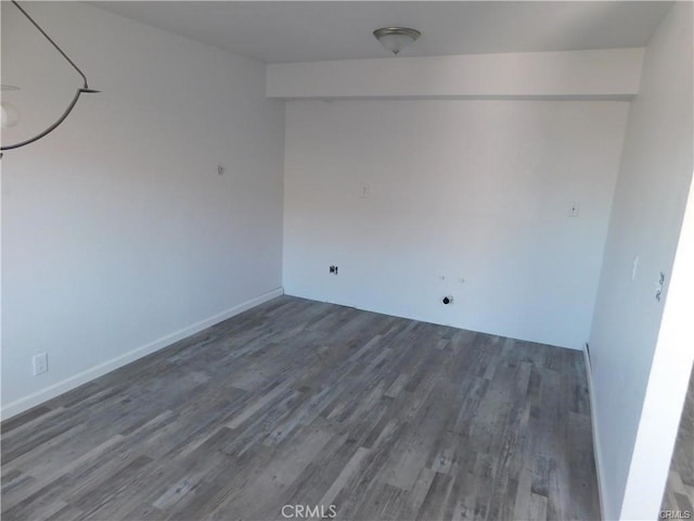 unfurnished room featuring dark hardwood / wood-style flooring