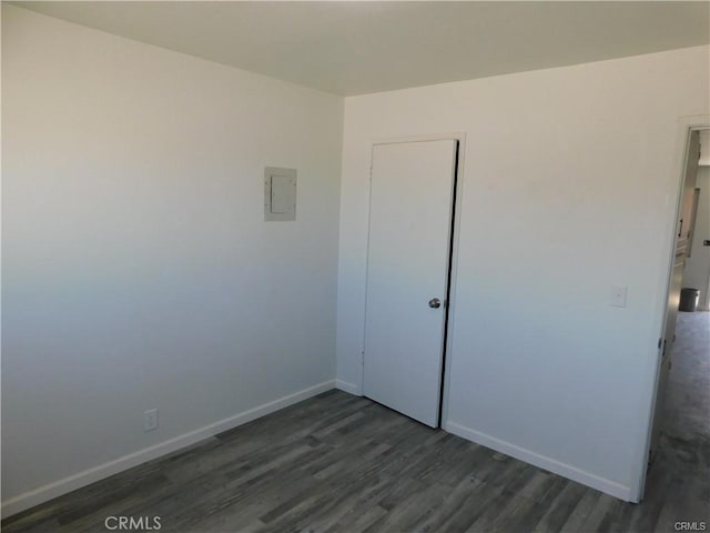 unfurnished bedroom featuring dark hardwood / wood-style floors