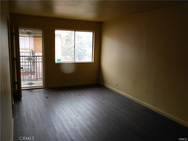 empty room featuring dark wood-type flooring