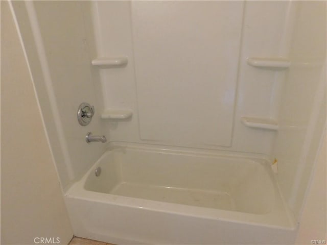 bathroom with bathing tub / shower combination