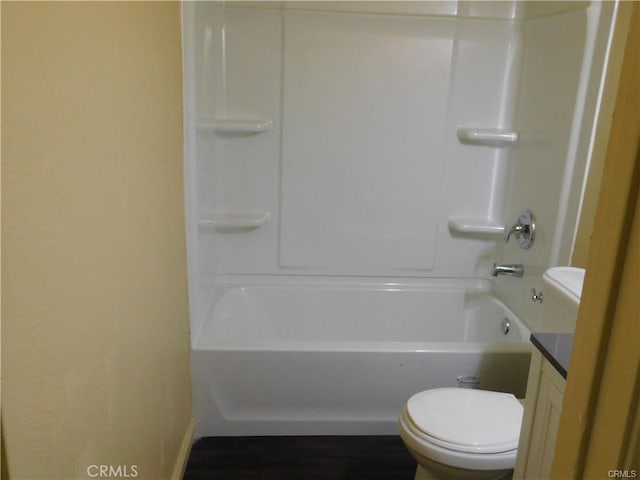 full bathroom featuring toilet, vanity, and bathing tub / shower combination