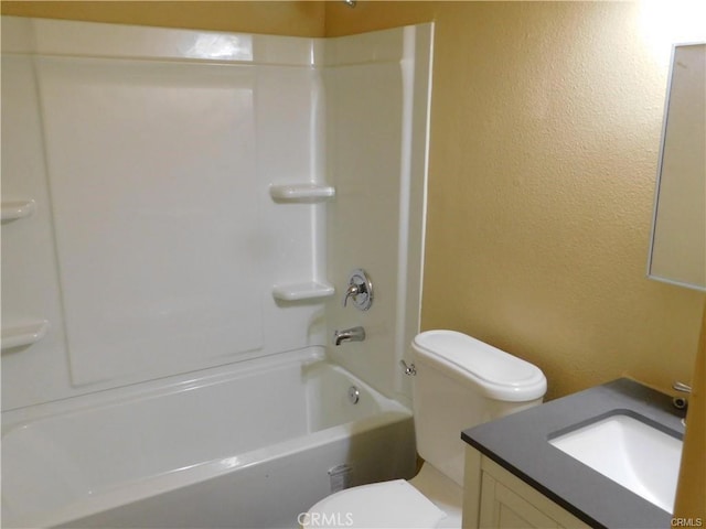 full bathroom with toilet, vanity, and  shower combination