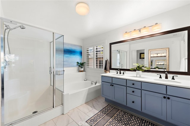 bathroom featuring vanity and shower with separate bathtub