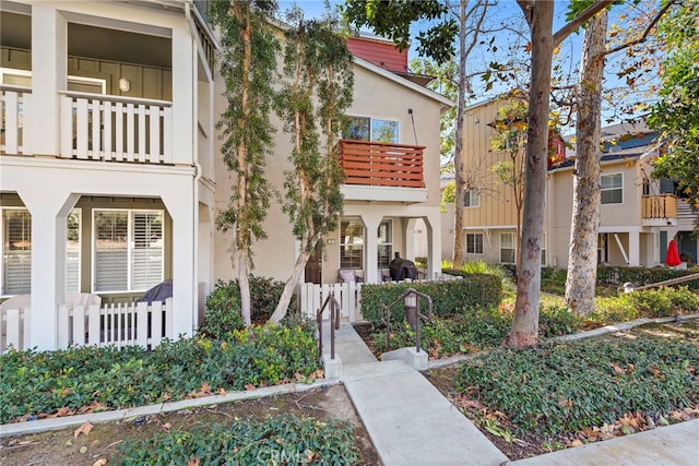 view of front of home with a balcony