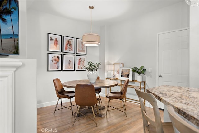 dining area featuring light wood-type flooring