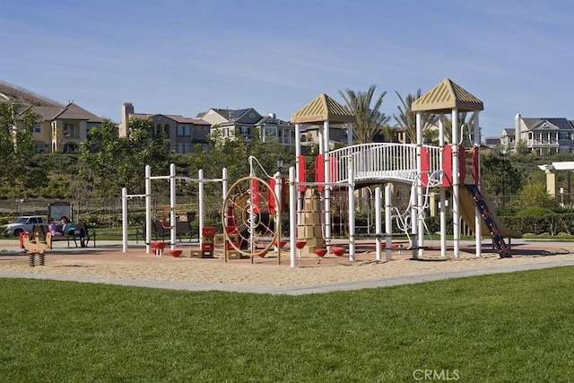 view of jungle gym with a lawn