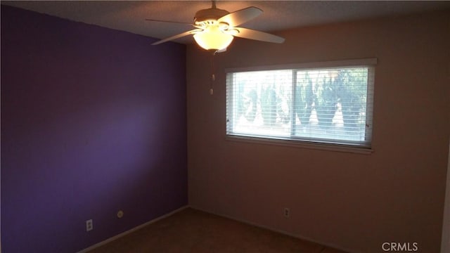 unfurnished room featuring ceiling fan