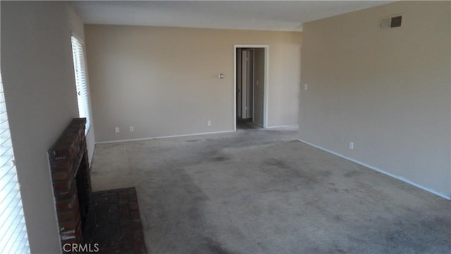 unfurnished living room with carpet flooring