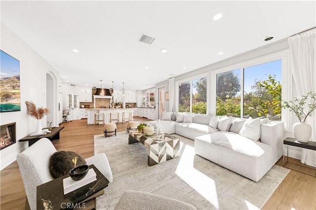 living room with light hardwood / wood-style floors