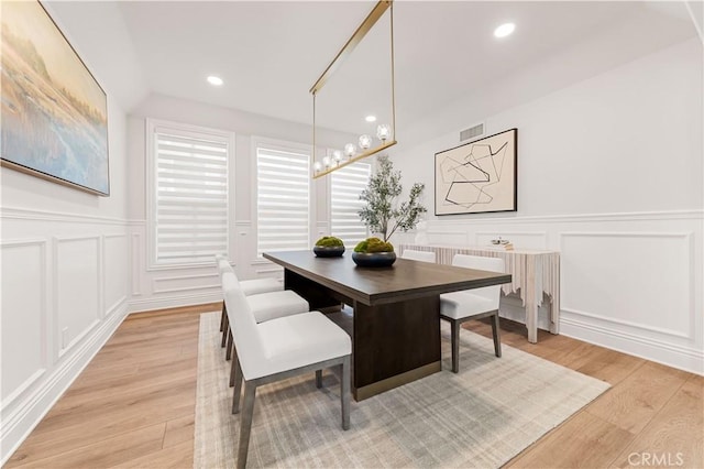 dining area with light hardwood / wood-style floors