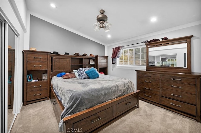 carpeted bedroom with lofted ceiling