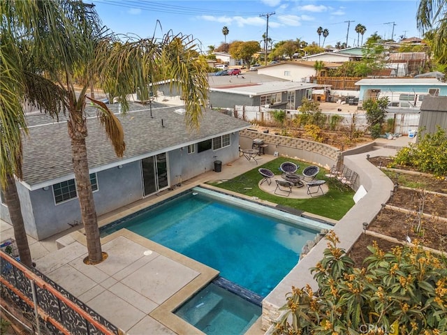 view of swimming pool featuring an outdoor fire pit, a patio area, and an in ground hot tub